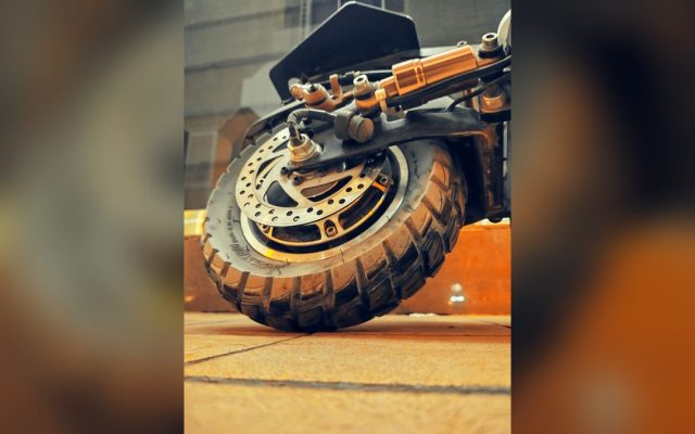 Close-up of an electric scooter's wheel and brake