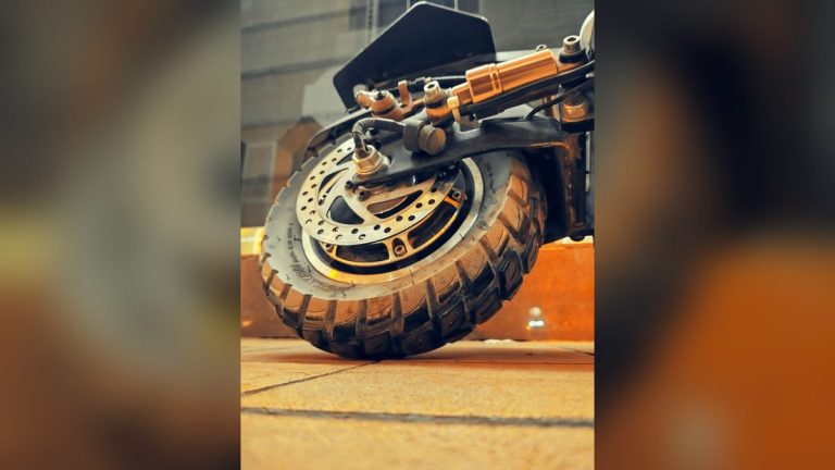 Close-up of an electric scooter's wheel and brake