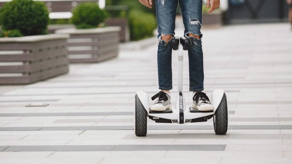 Close-up of feet on a self-balancing scooter