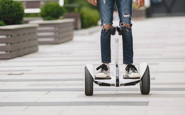 Close-up of feet on a self-balancing scooter