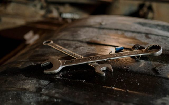 Close-up of wrenches on a workshop surface