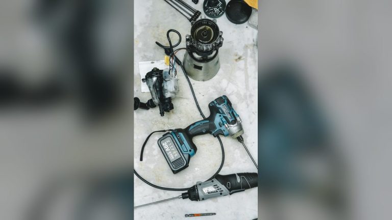 DIY repair tools and disassembled appliance parts