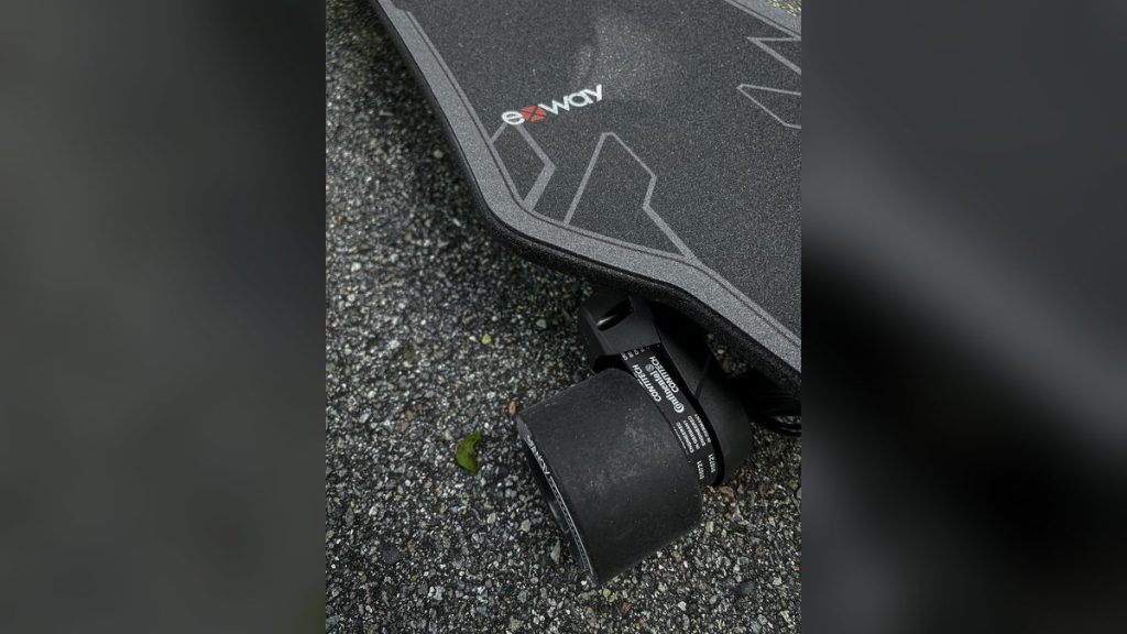 Electric longboard wheel and deck close-up