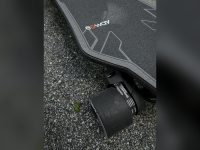 Electric longboard wheel and deck close-up