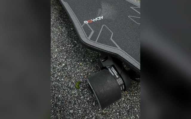 Electric longboard wheel and deck close-up