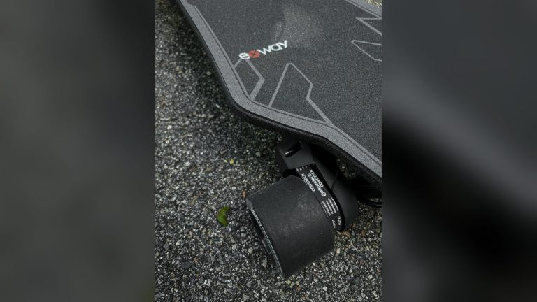 Electric longboard wheel and deck close-up