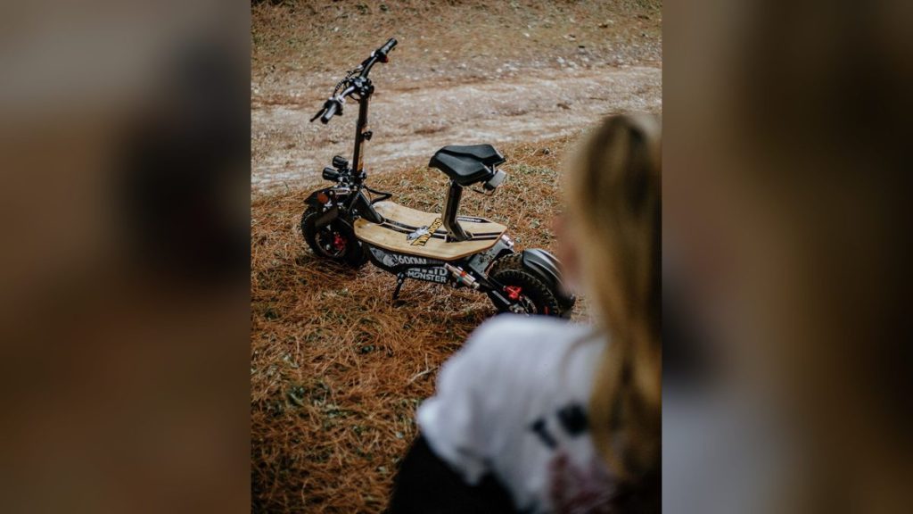 Electric scooter parked on a dirt path