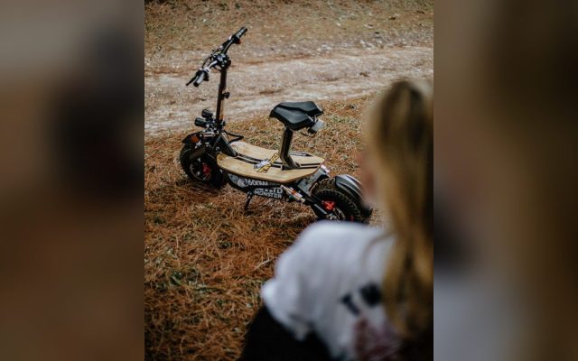 Electric scooter parked on a dirt path