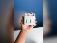 Hand holding a battery charger