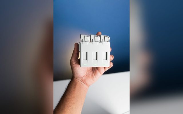 Hand holding a battery charger