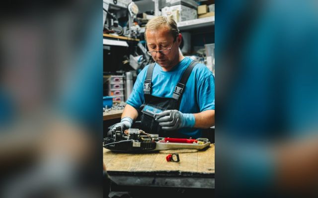 Mechanic working on a device in a workshop