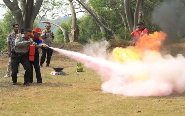 People extinguishing a fire during safety training