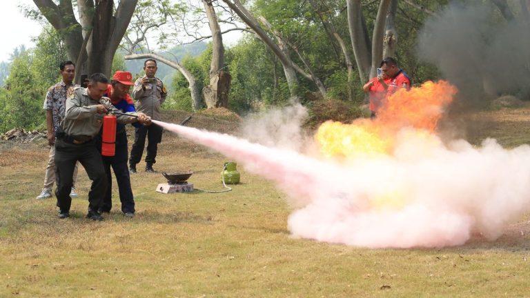 People extinguishing a fire during safety training