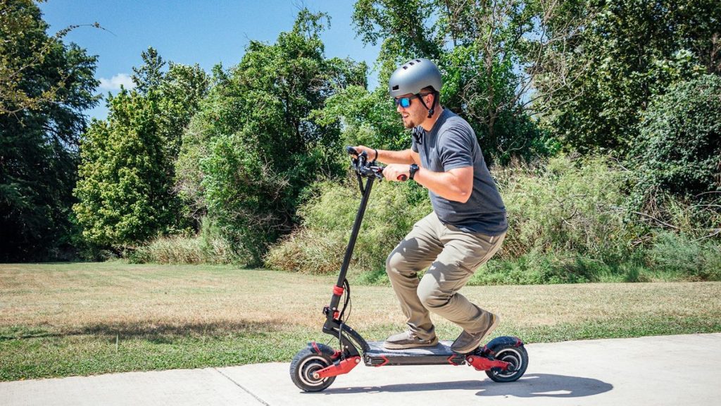Rider carving on a dual-motor electric scooter