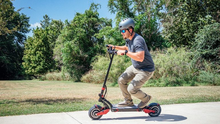 Rider carving on a dual-motor electric scooter