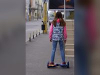 Rider on a hoverboard on a street