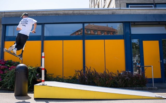 Rider performing a scooter stunt in the city