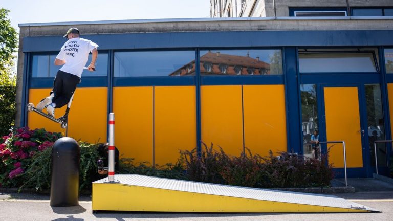 Rider performing a scooter stunt in the city