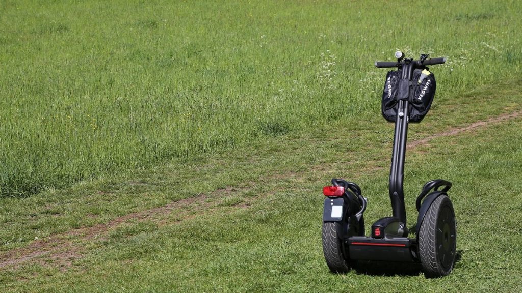 Self-balancing scooter on a grassy lawn