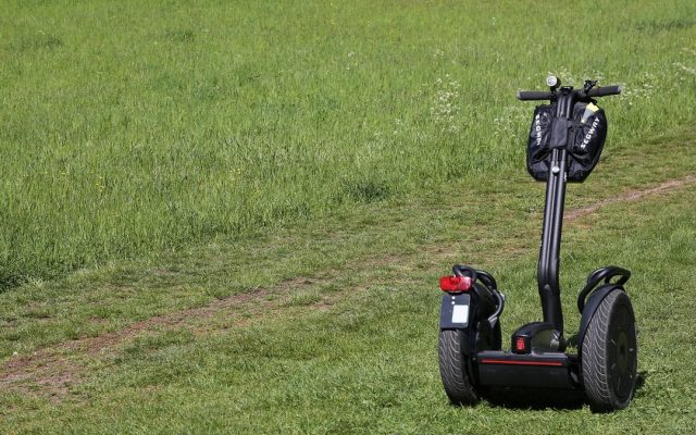 Self-balancing scooter on a grassy lawn