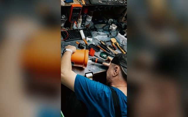 Technician repairing electronic equipment