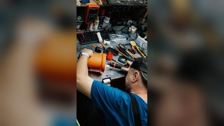 Technician repairing electronic equipment