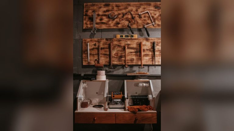 Tools arranged on a wooden pegboard