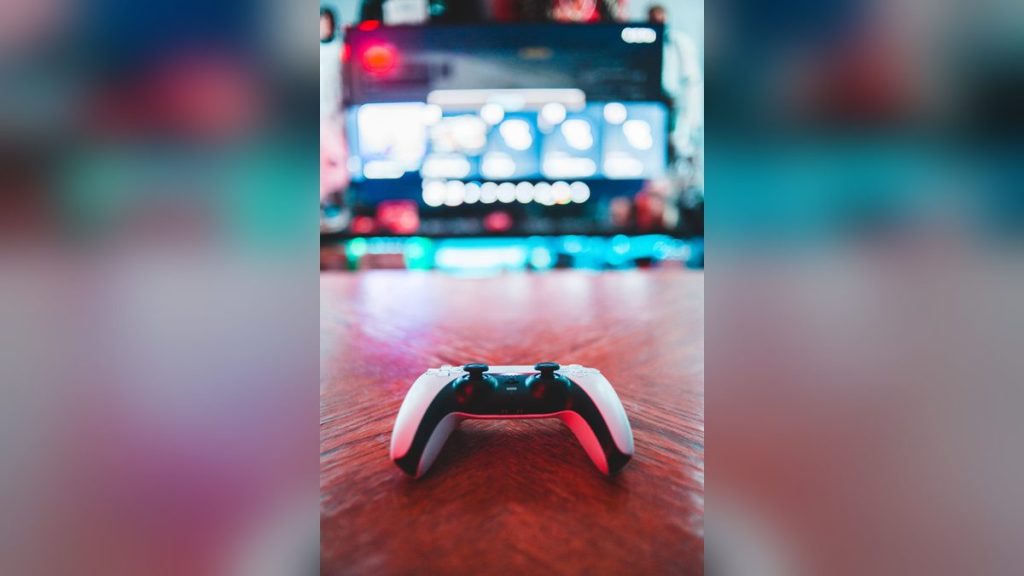 White game controller on a wooden table