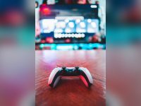 White game controller on a wooden table