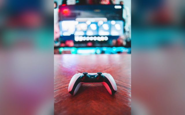 White game controller on a wooden table