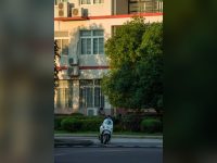White scooter near an urban building