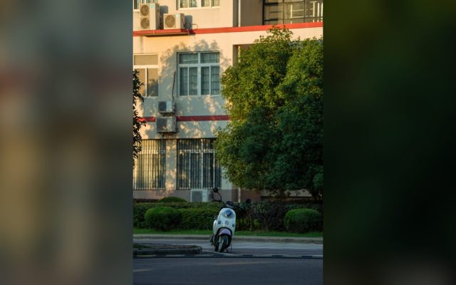 White scooter near an urban building