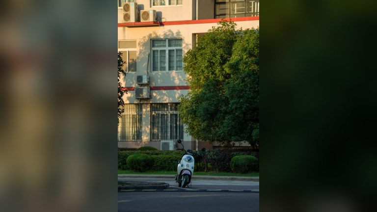 White scooter near an urban building