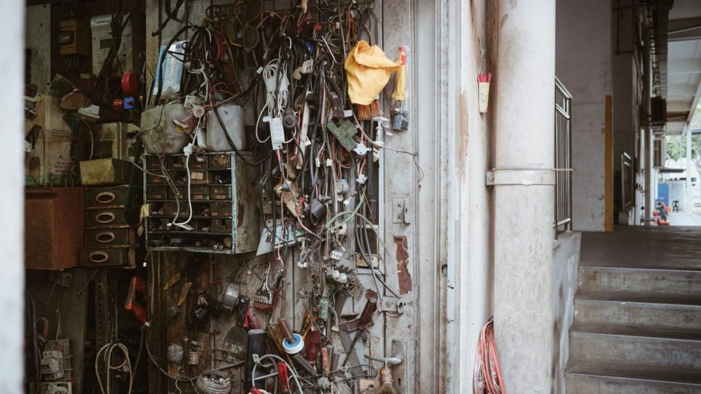 Wires, tools and gadgets on a workshop wall