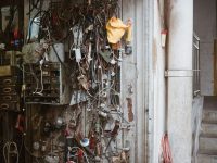 Wires, tools and gadgets on a workshop wall