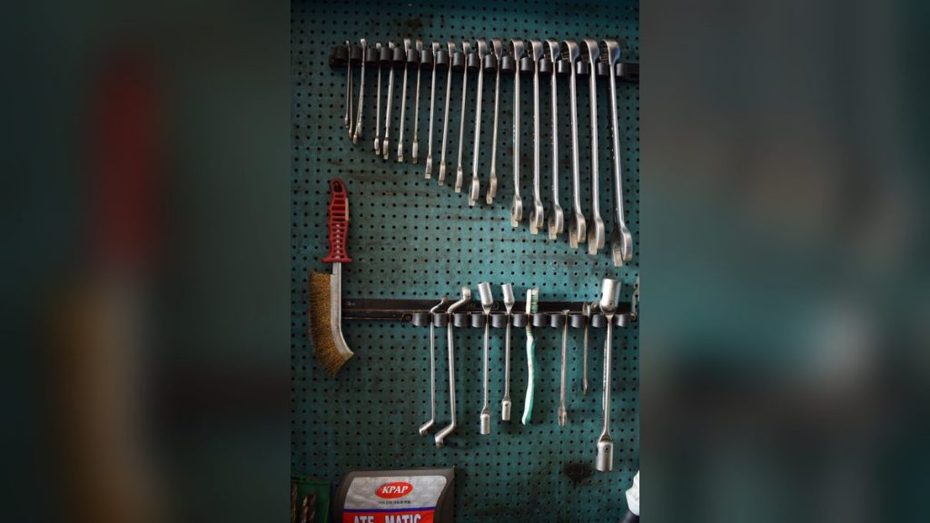 Wrenches and tools on a pegboard