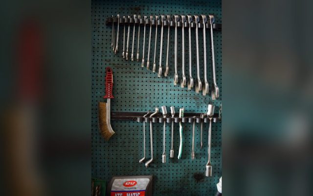 Wrenches and tools on a pegboard