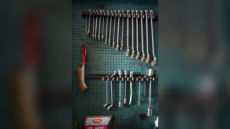 Wrenches and tools on a pegboard