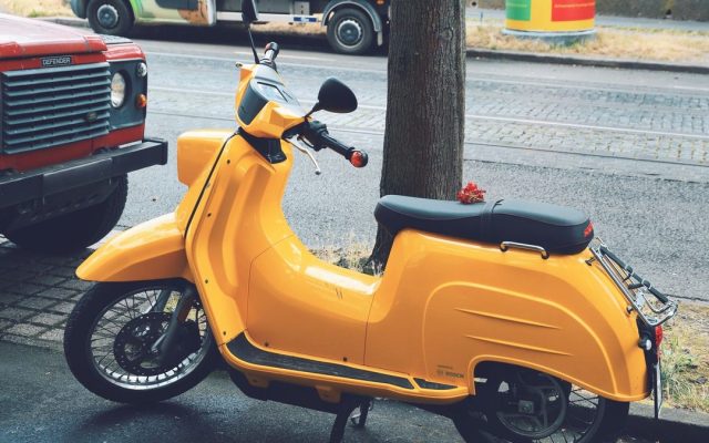 Yellow scooter on a city street