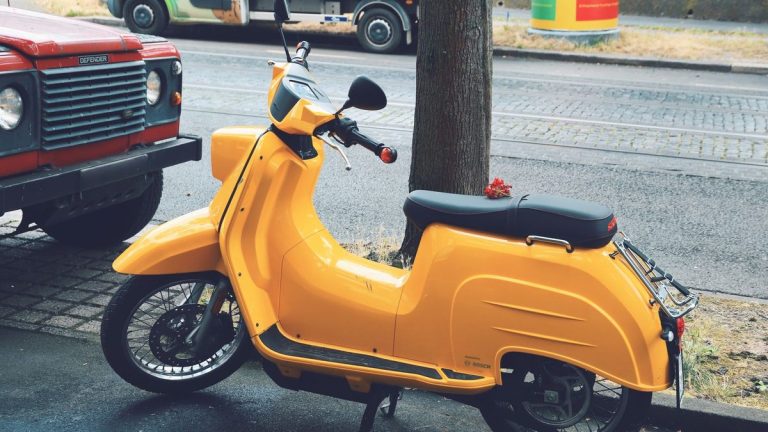 Yellow scooter on a city street