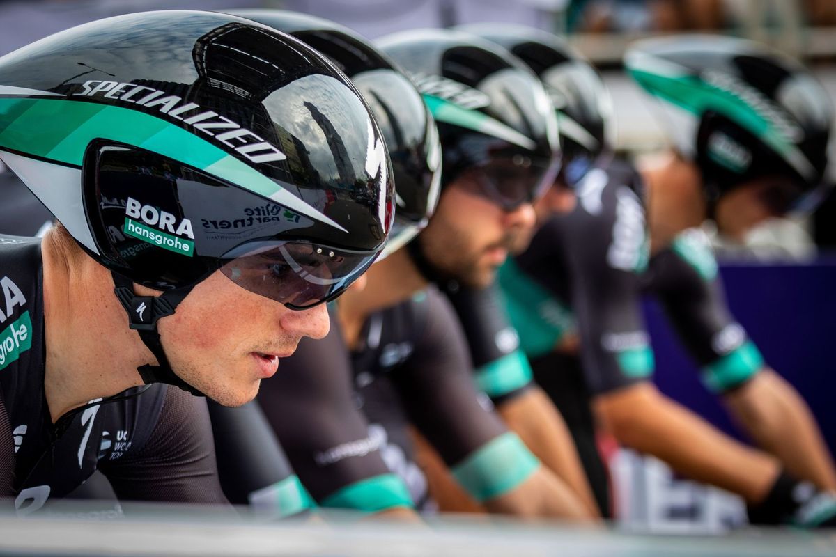 Close-up of professional cyclists in a competitive race wearing aerodynamic helmets in Hong Kong