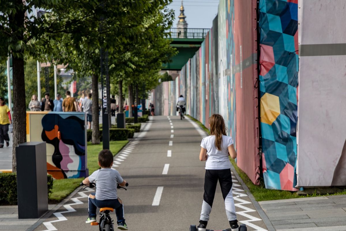 Girl riding a hoverboard on a bike path