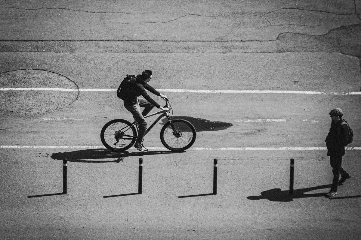 Monochrome image of a cyclist on city streets