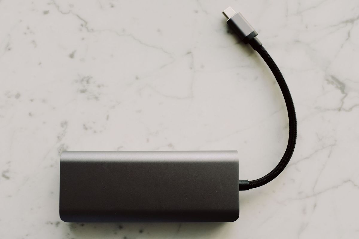 Sleek power bank with USB-C cable on a marble surface