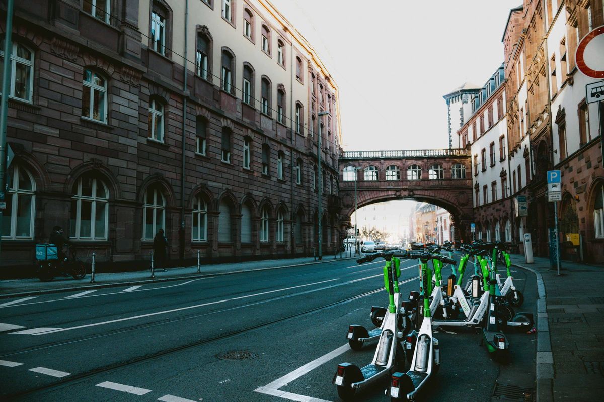 Street scene in Frankfurt am Main with electric scooters and historic architecture